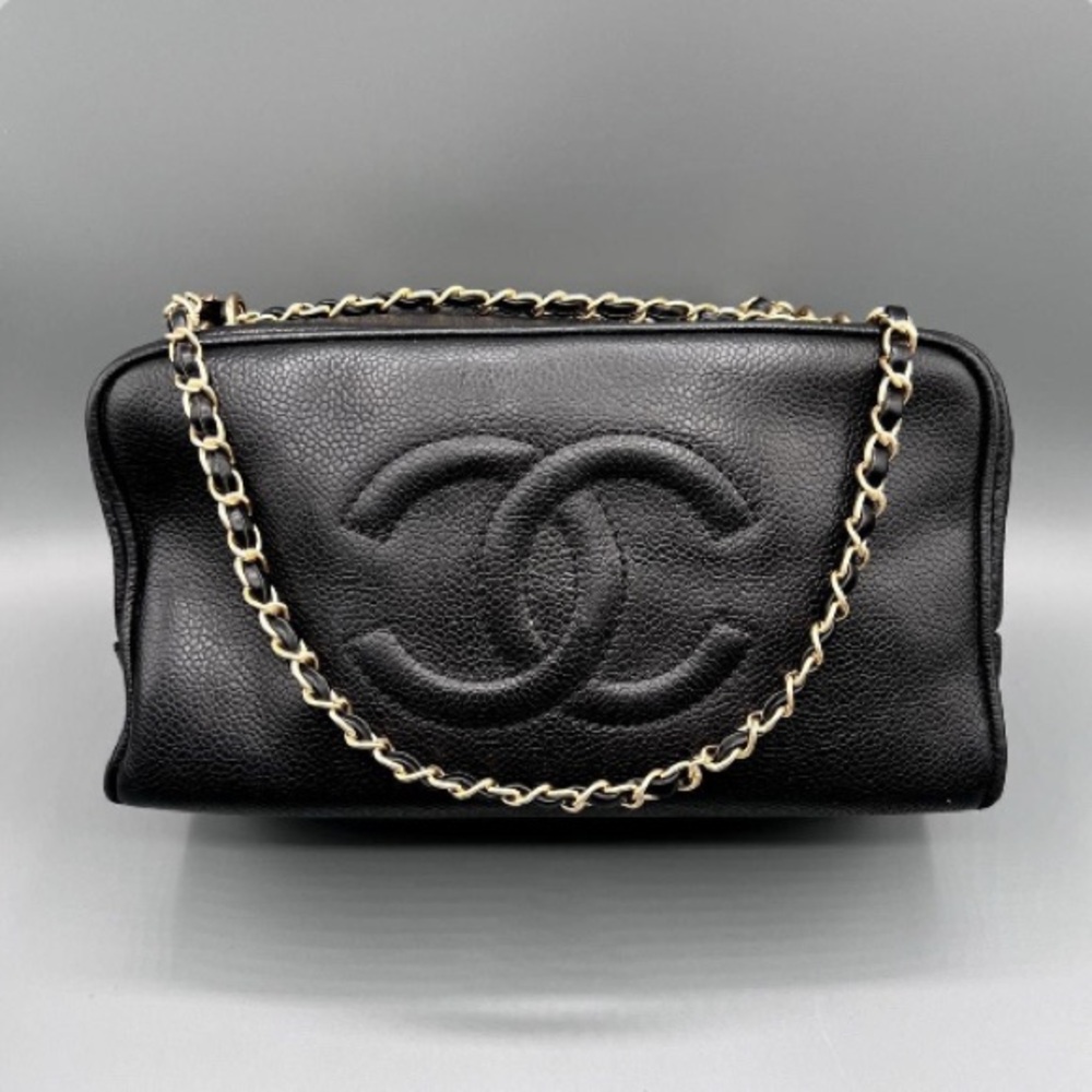 CHANEL Black Leather Cosmetic Bag with Gold Chain Measurements: 9x5x4